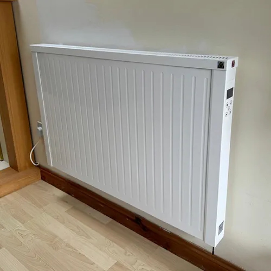 A NEOS electric radiator fitted under a window